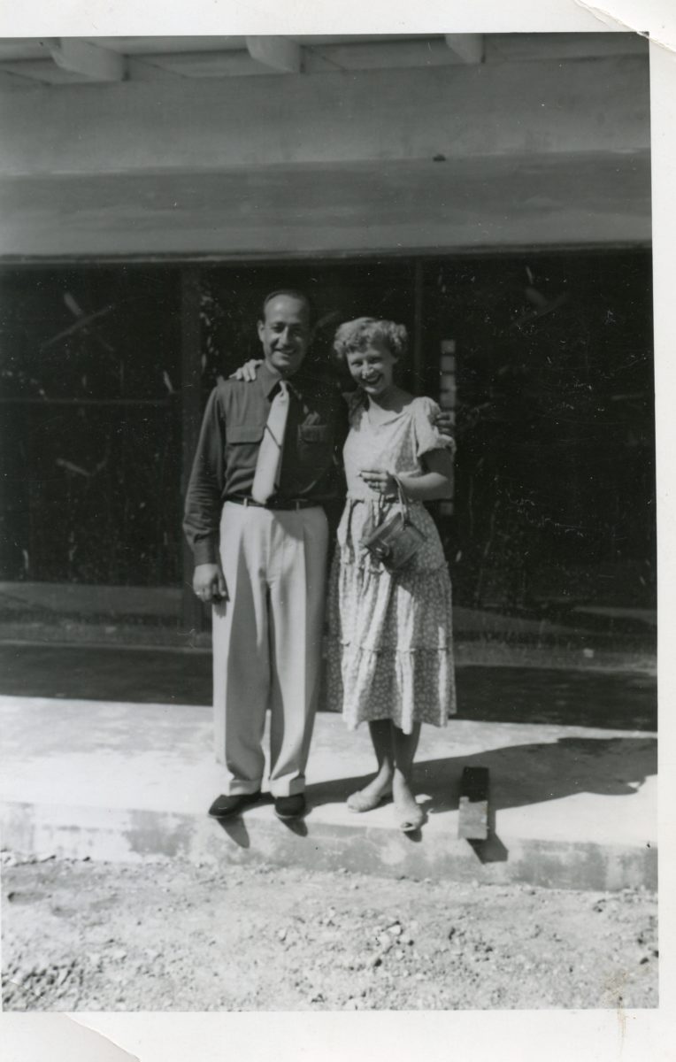 Anthony DeRiggi with an unidentified client. They are standing on the foundation of a home that he was building for her.