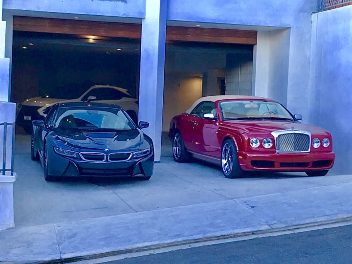 Luxury cars parked in garage